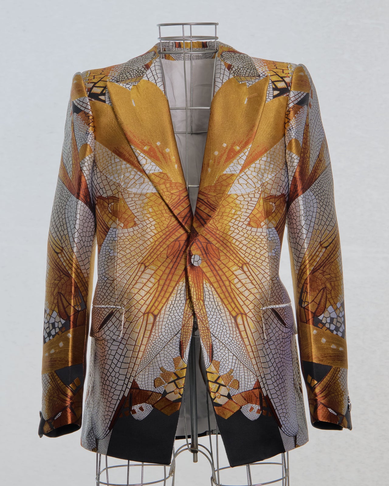 Patterned Alexander McQueen jacket on a mannequin against a white background