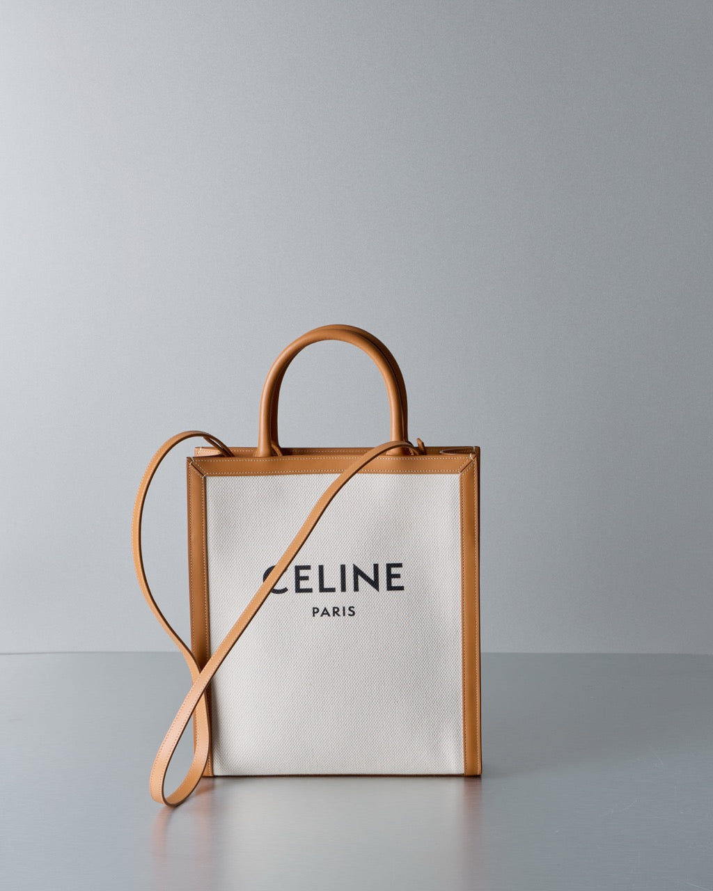 Celine bag with wooden handles on a gray background