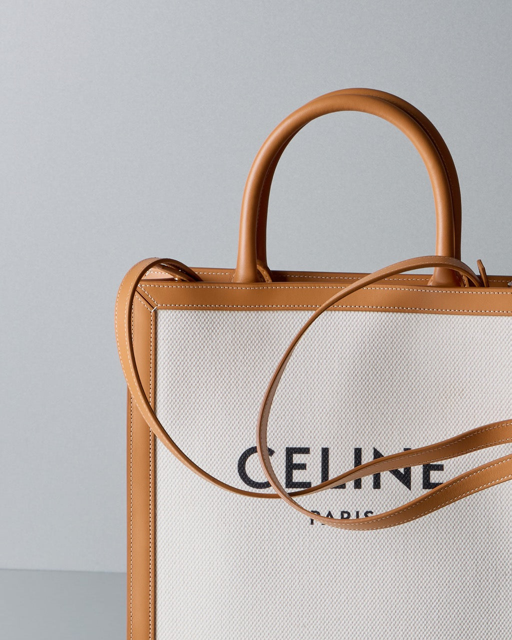 Celine bag with wooden handles on a gray background