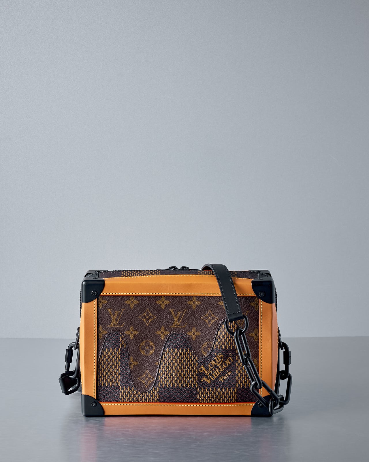 Louis Vuitton x Nigo bag with monogram pattern on a grey background