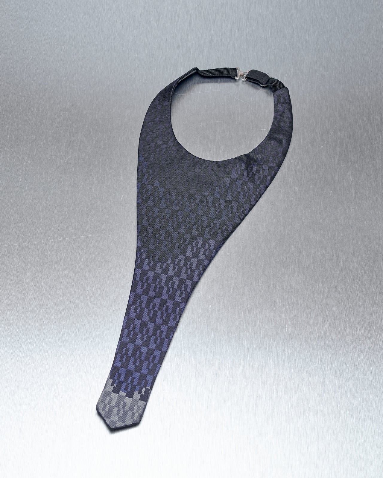 A Prada Cravat neck tie with a jacquard satin silk pattern in blue and gray tones, featuring a flat face and tie-like drop.