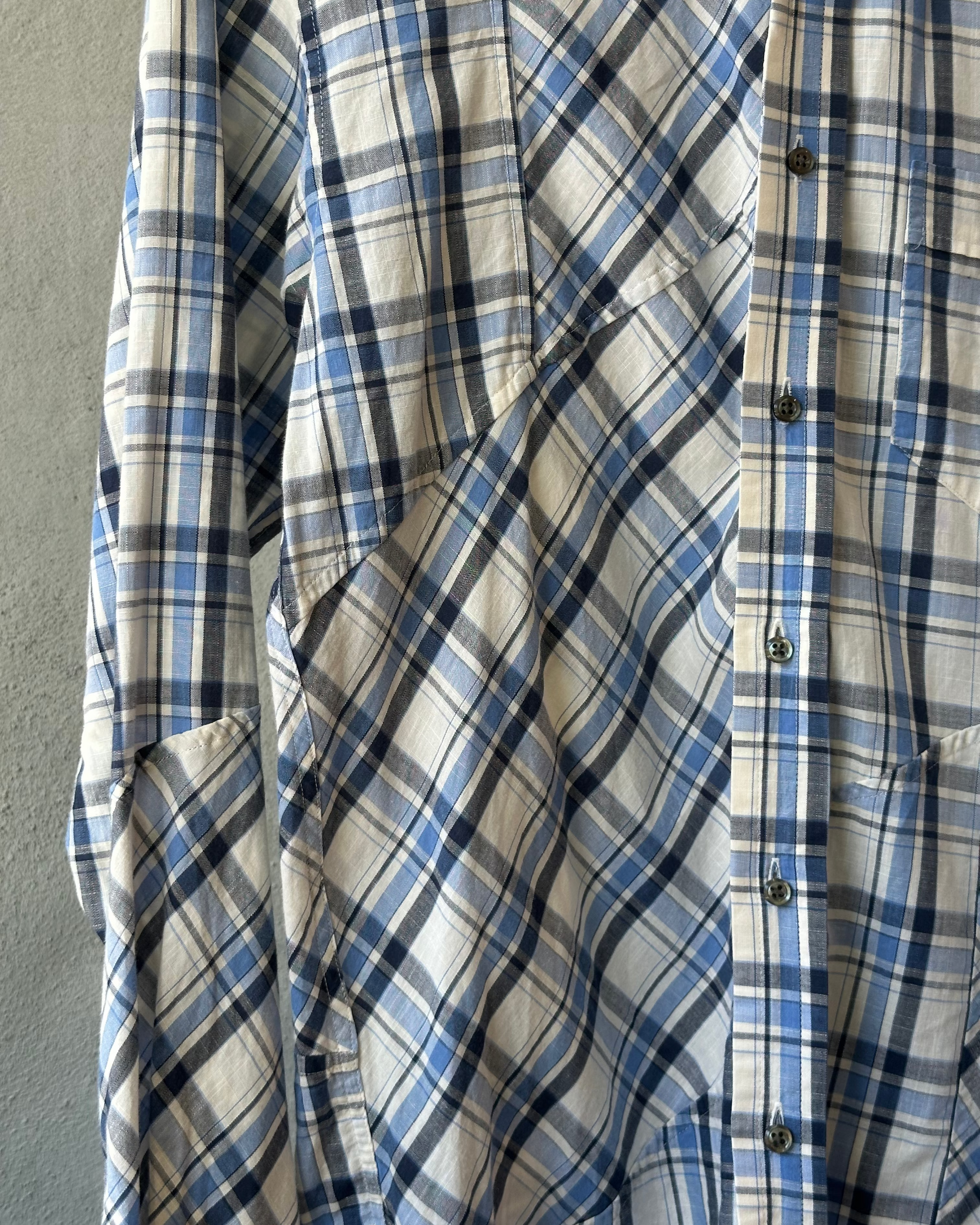 Blue and white AAR by Yohji Yamamoto plaid shirt on a gray background