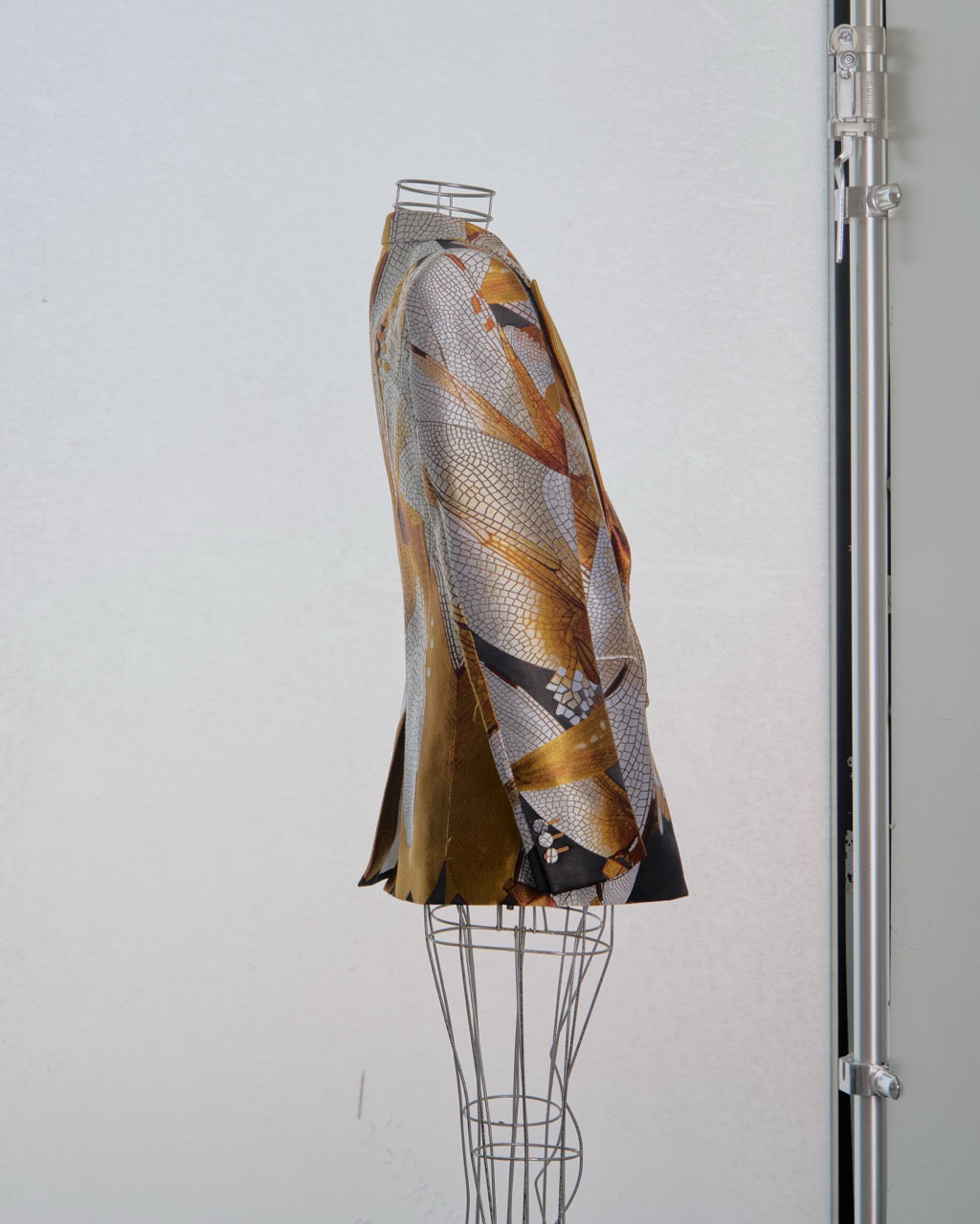 Patterned Alexander McQueen blazer on a mannequin against a white background