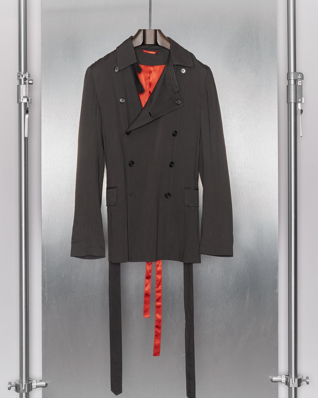 Man wearing a grey Ann Demeulemeester coat and pants on a runway