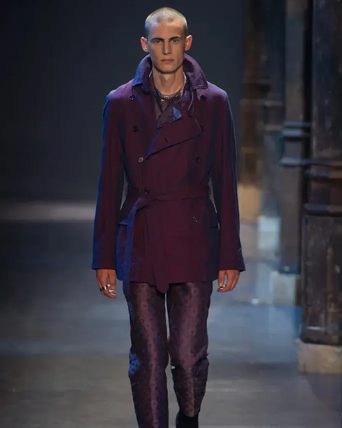 Man wearing a grey Ann Demeulemeester coat and pants on a runway
