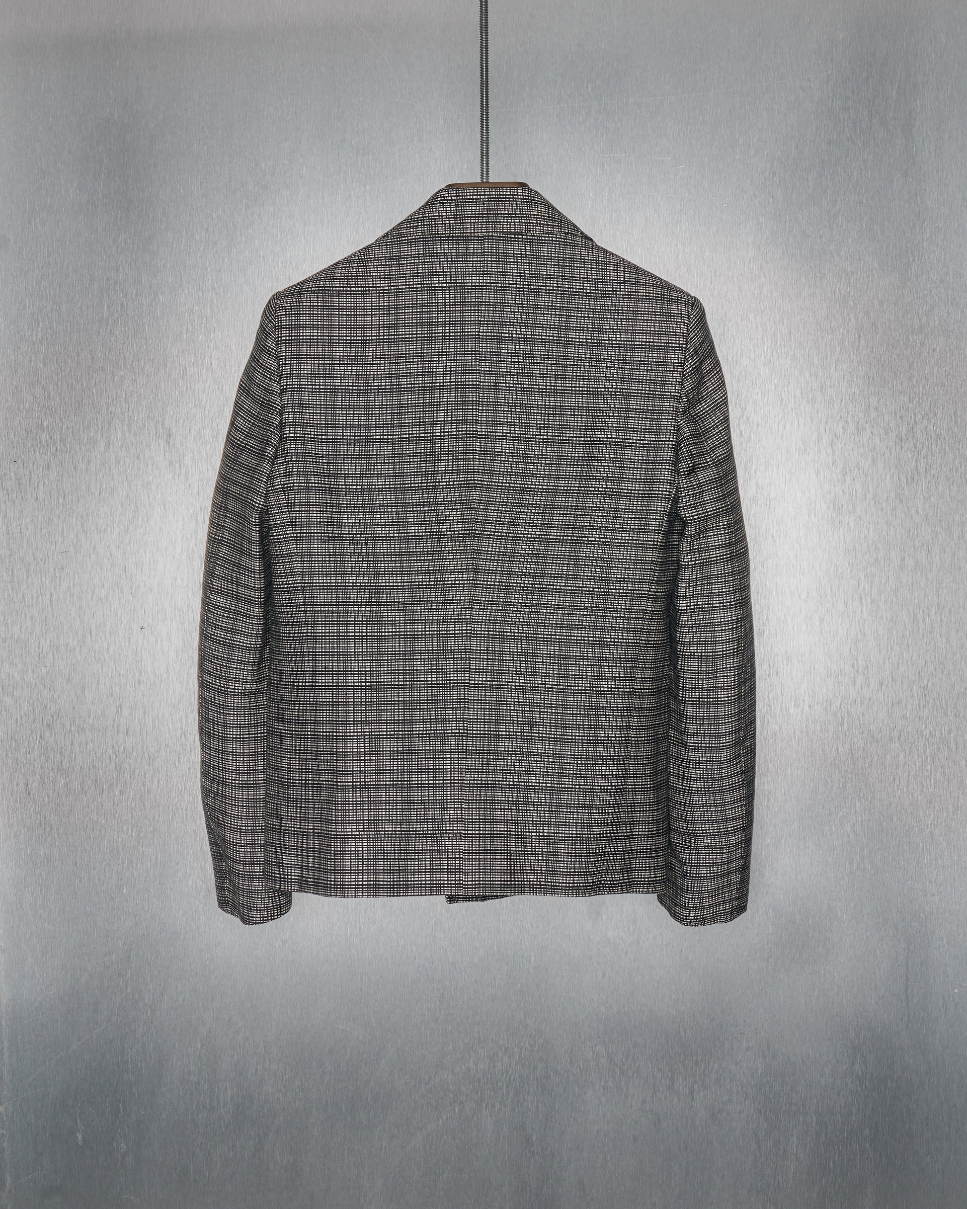 Back of Balenciaga grey checkered pea coat.