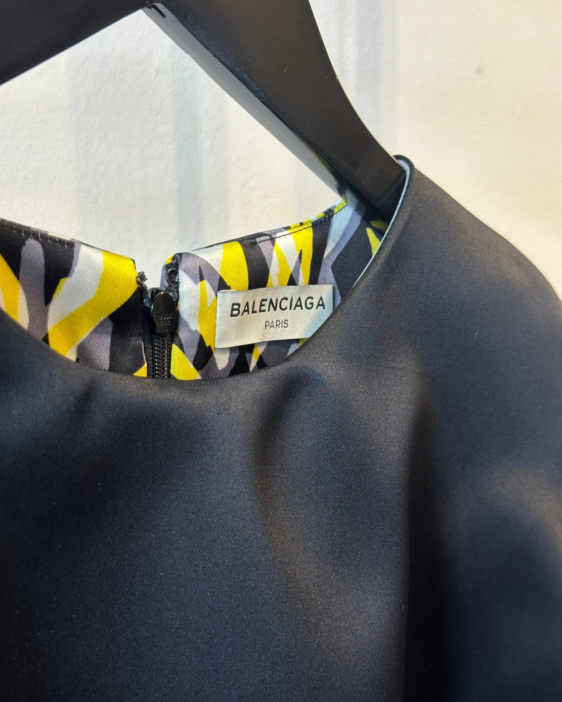 Close-up of a Balenciaga label on a garment with a blurred background