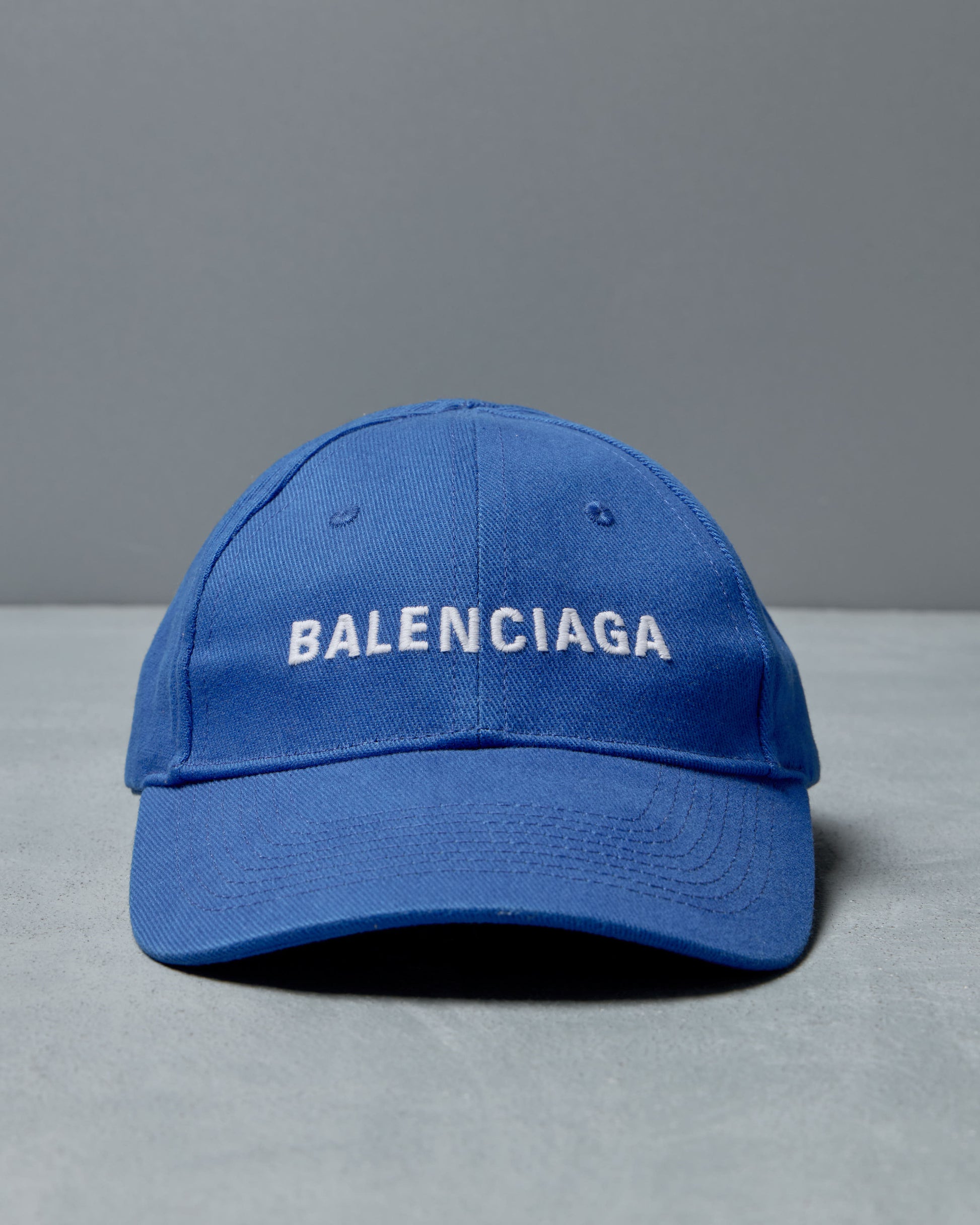 Blue Balenciaga cap on a gray background