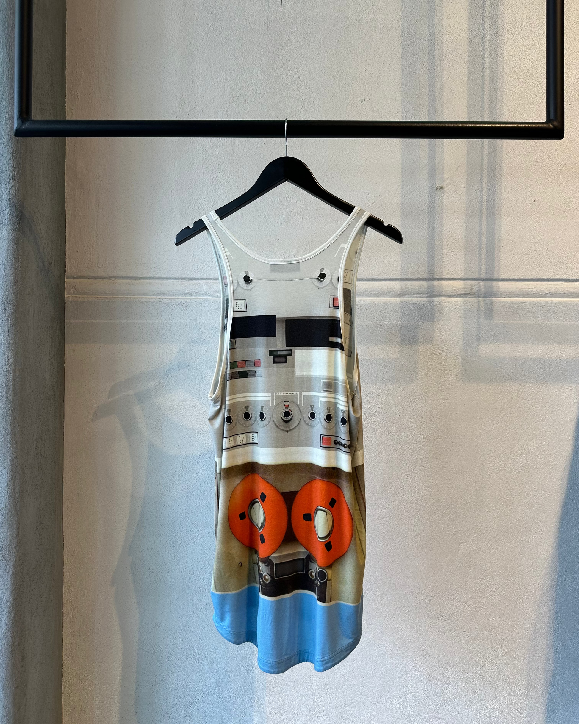 Givenchy tank top with a unique design on a hanger against a neutral background