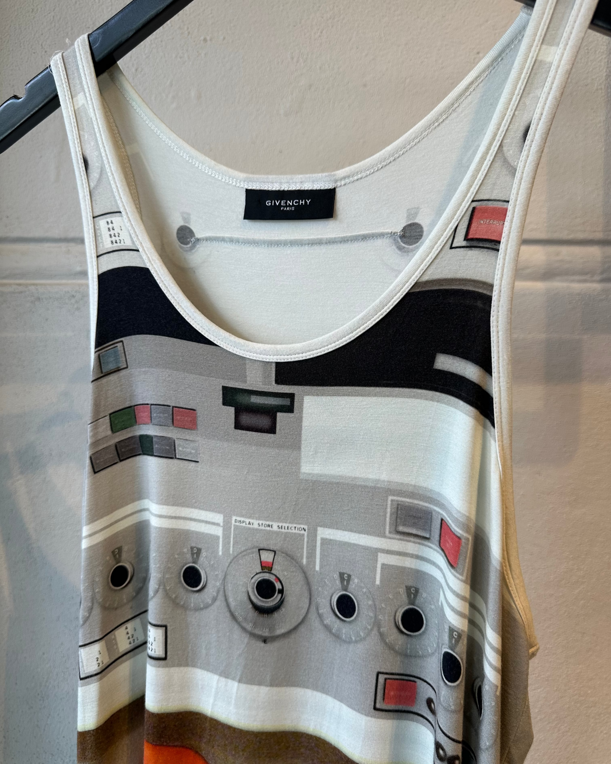 Givenchy tank top with a pattern resembling a robot suit, hanging on a rack.