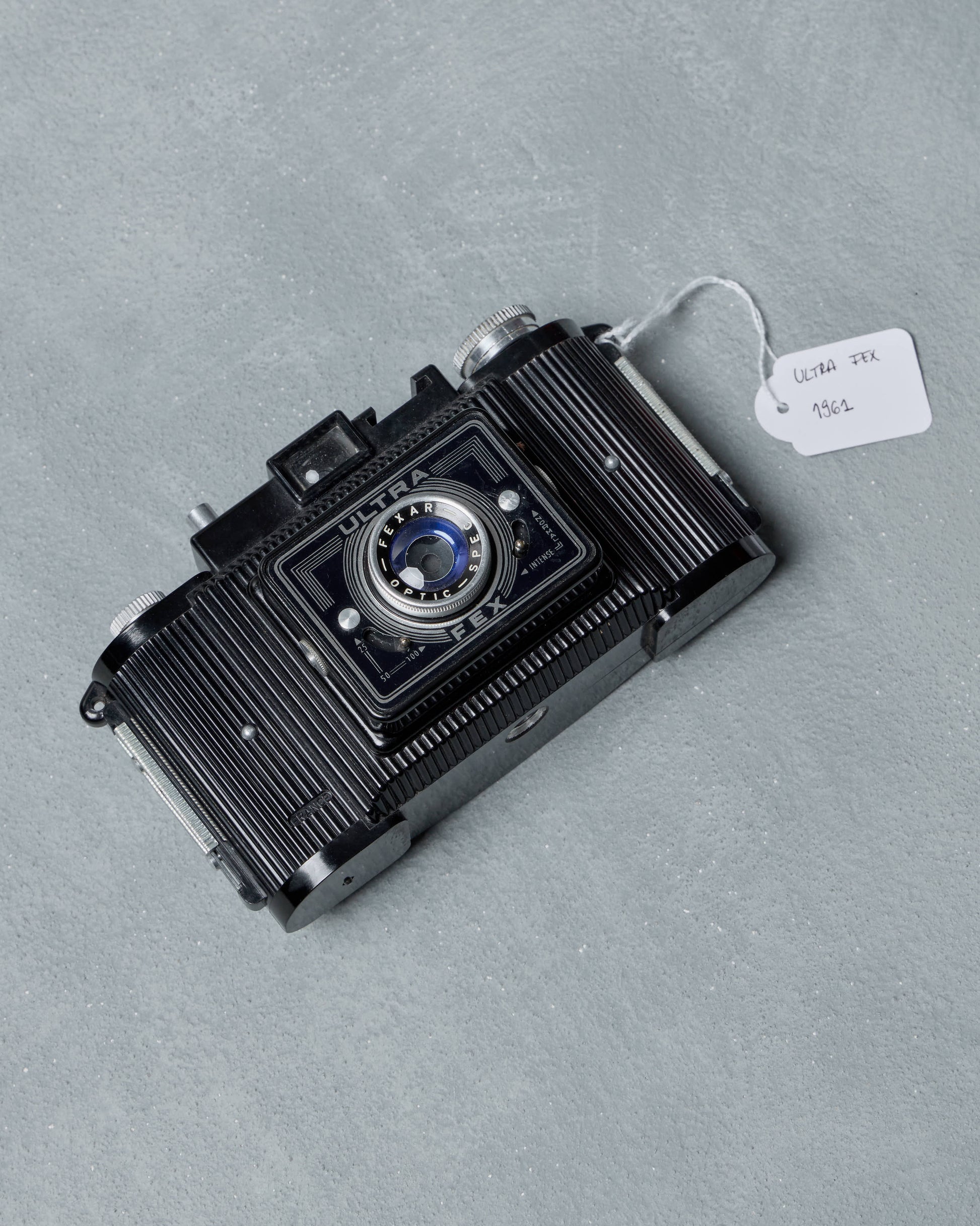Vintage Gucci camera on a gray background