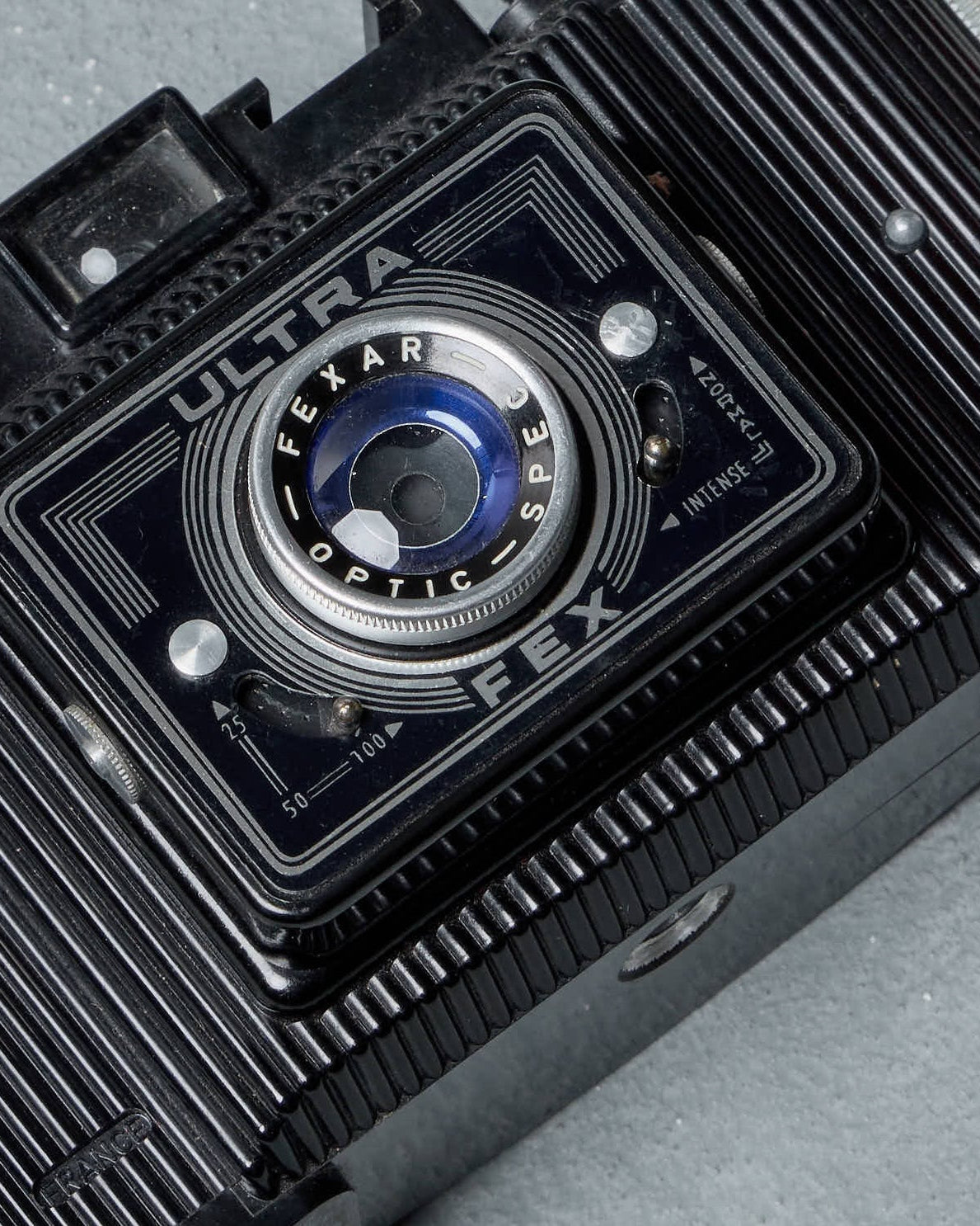 Vintage Gucci camera on a gray background
