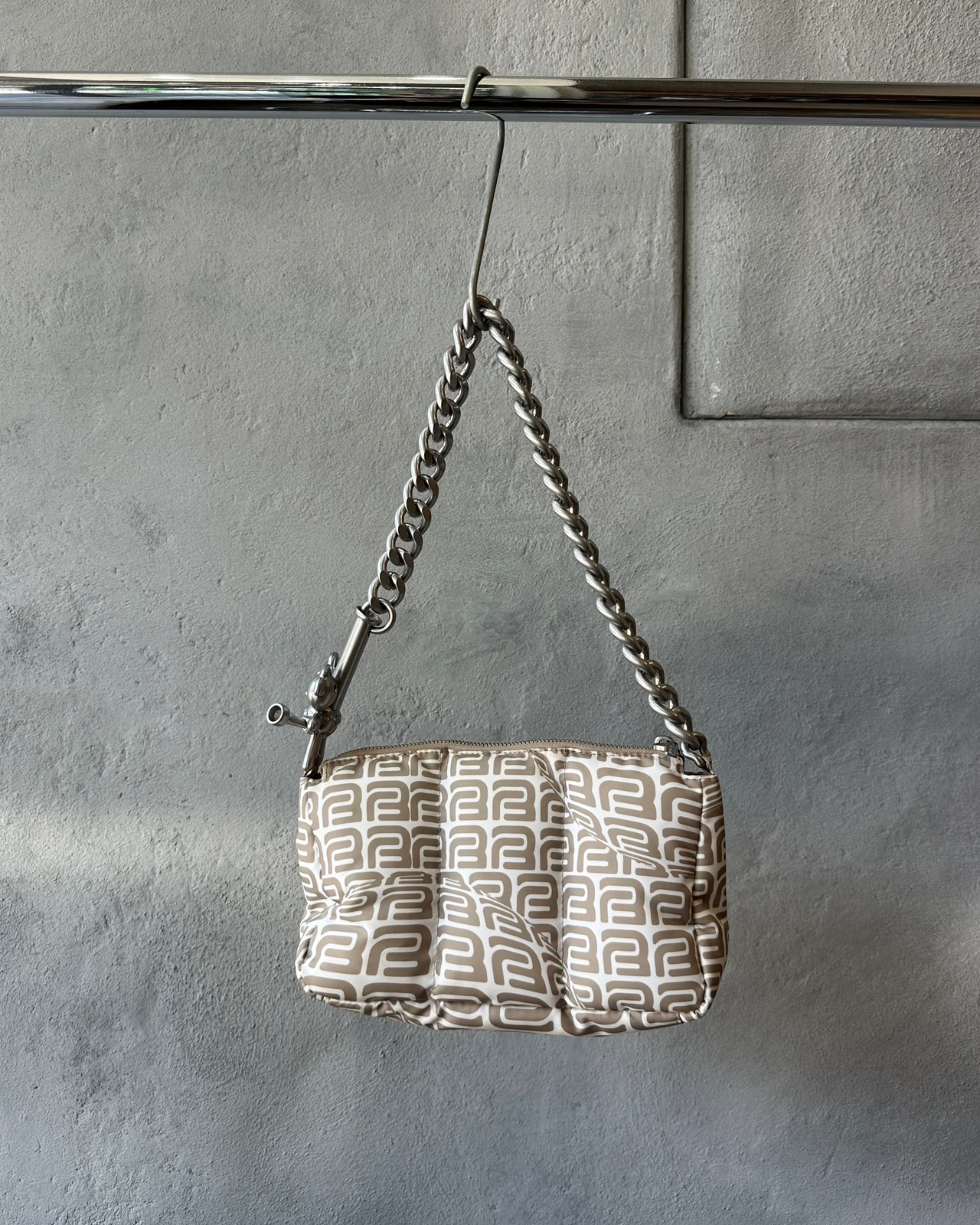 Heaven by Marc Jacobs Handbag with chain handle on a gray surface