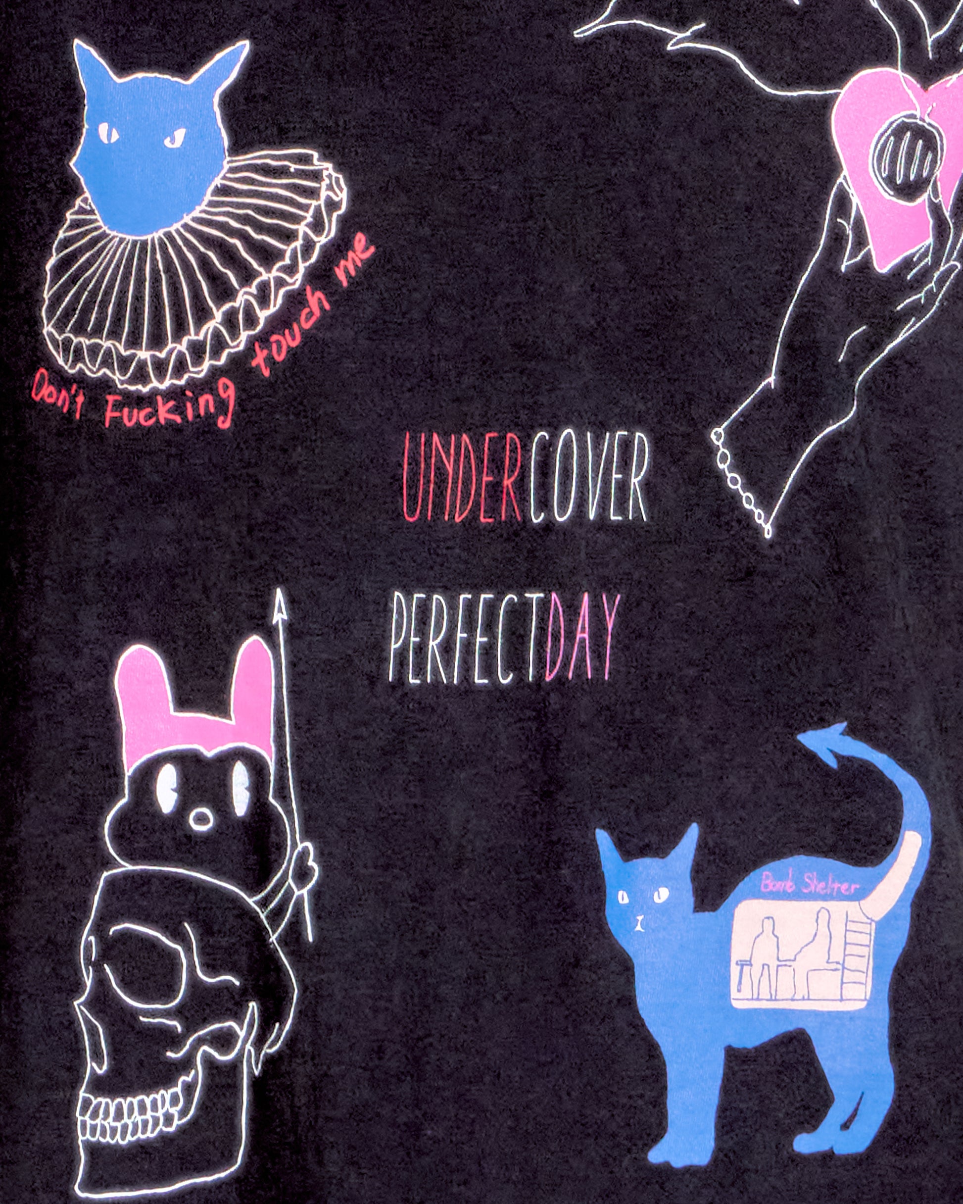 Black t-shirt with various graphic designs and text on a dark background