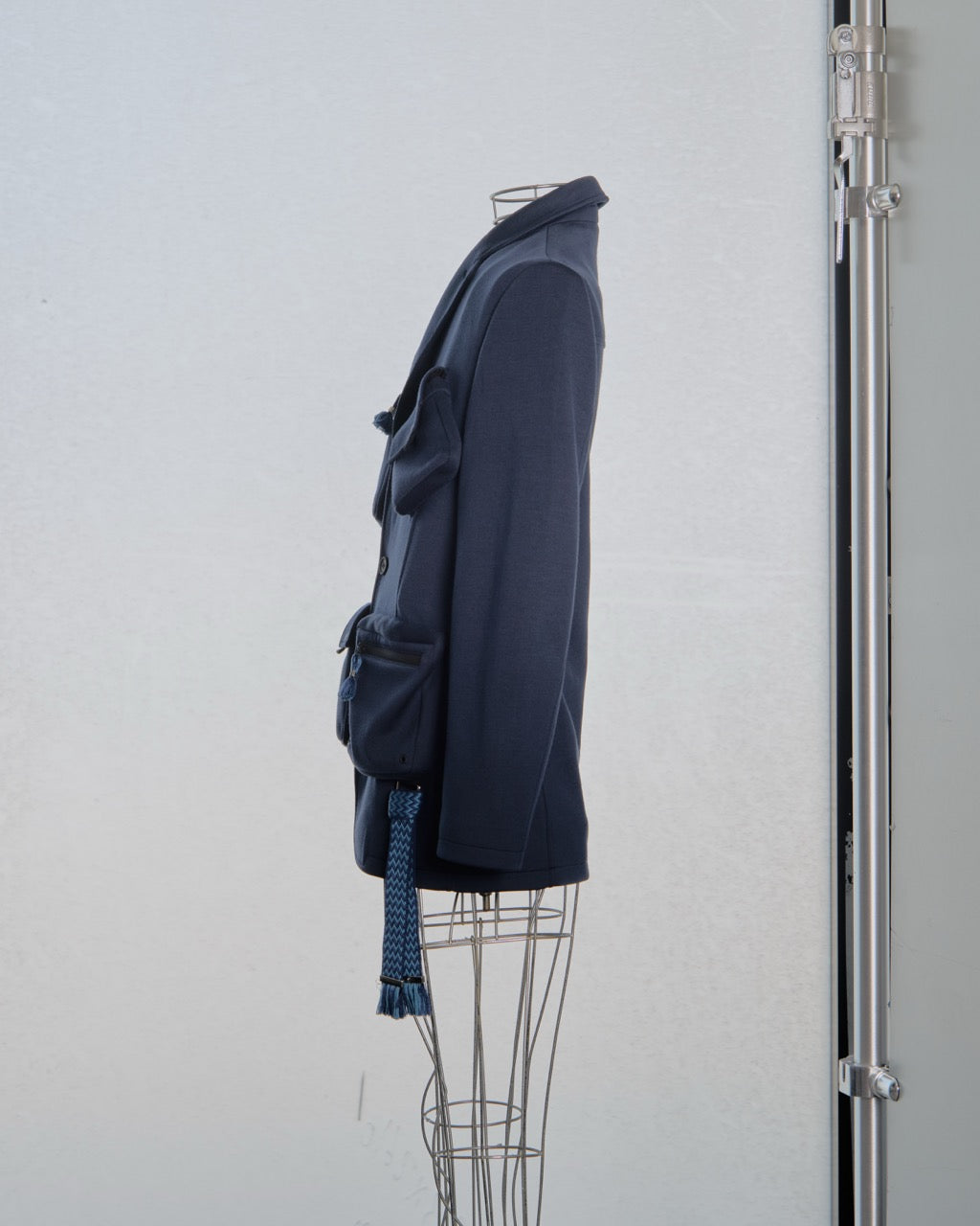 Navy blue Lanvin jacket on a mannequin against a white background