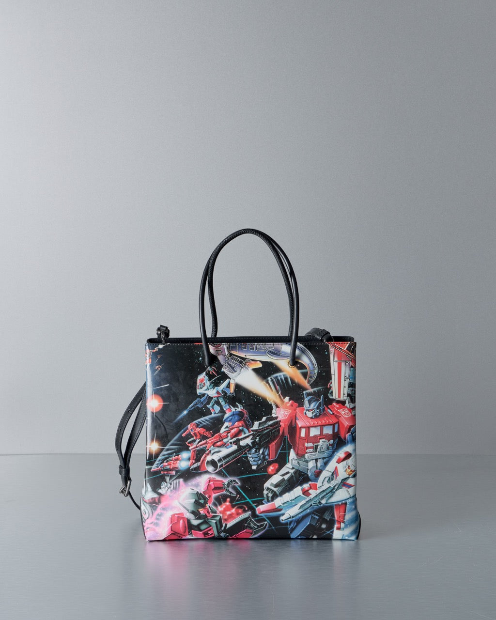 Moschino tote bag with robot design on a gray background