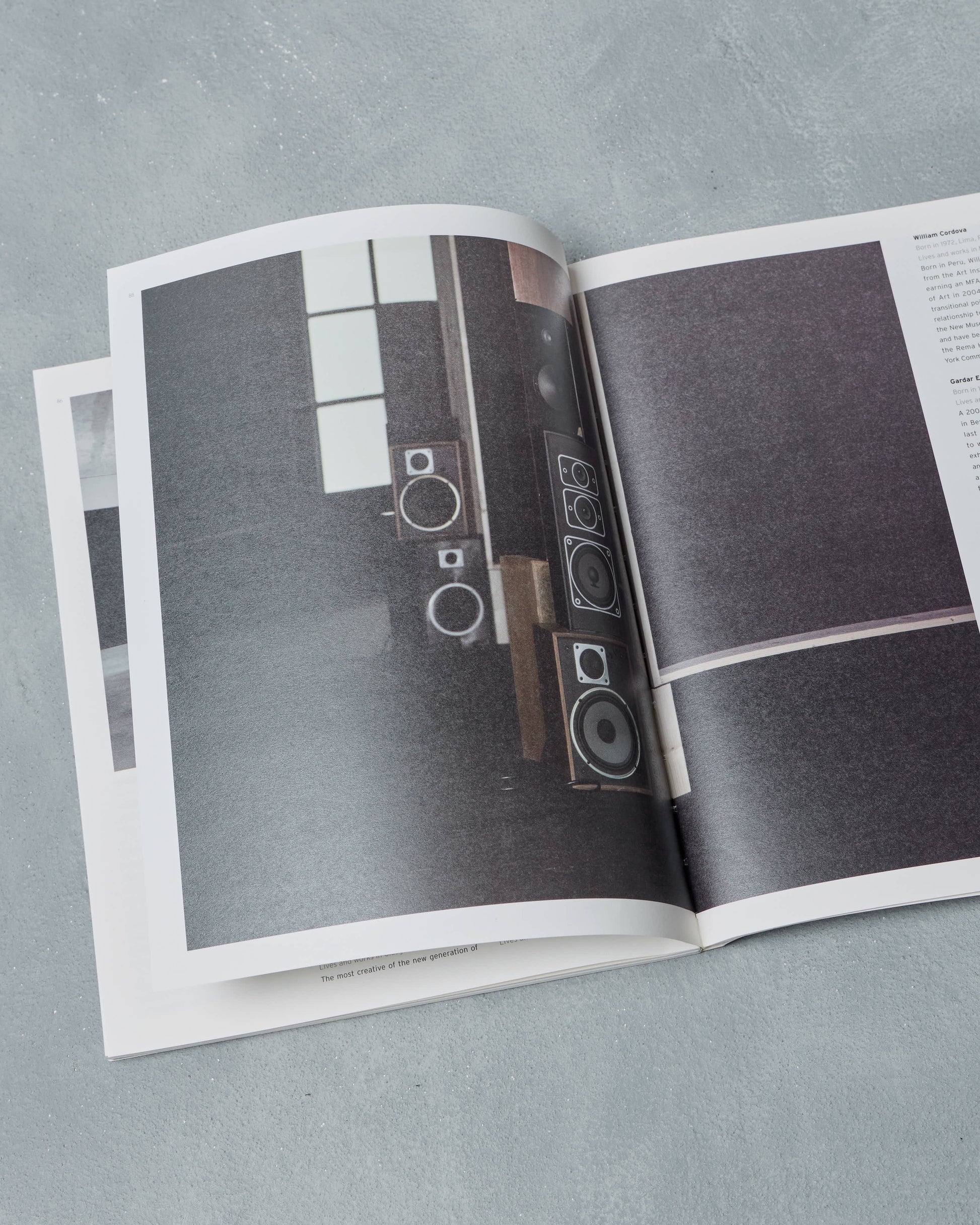 Open Ppaper Magazine showing a photograph of speakers on a gray surface
