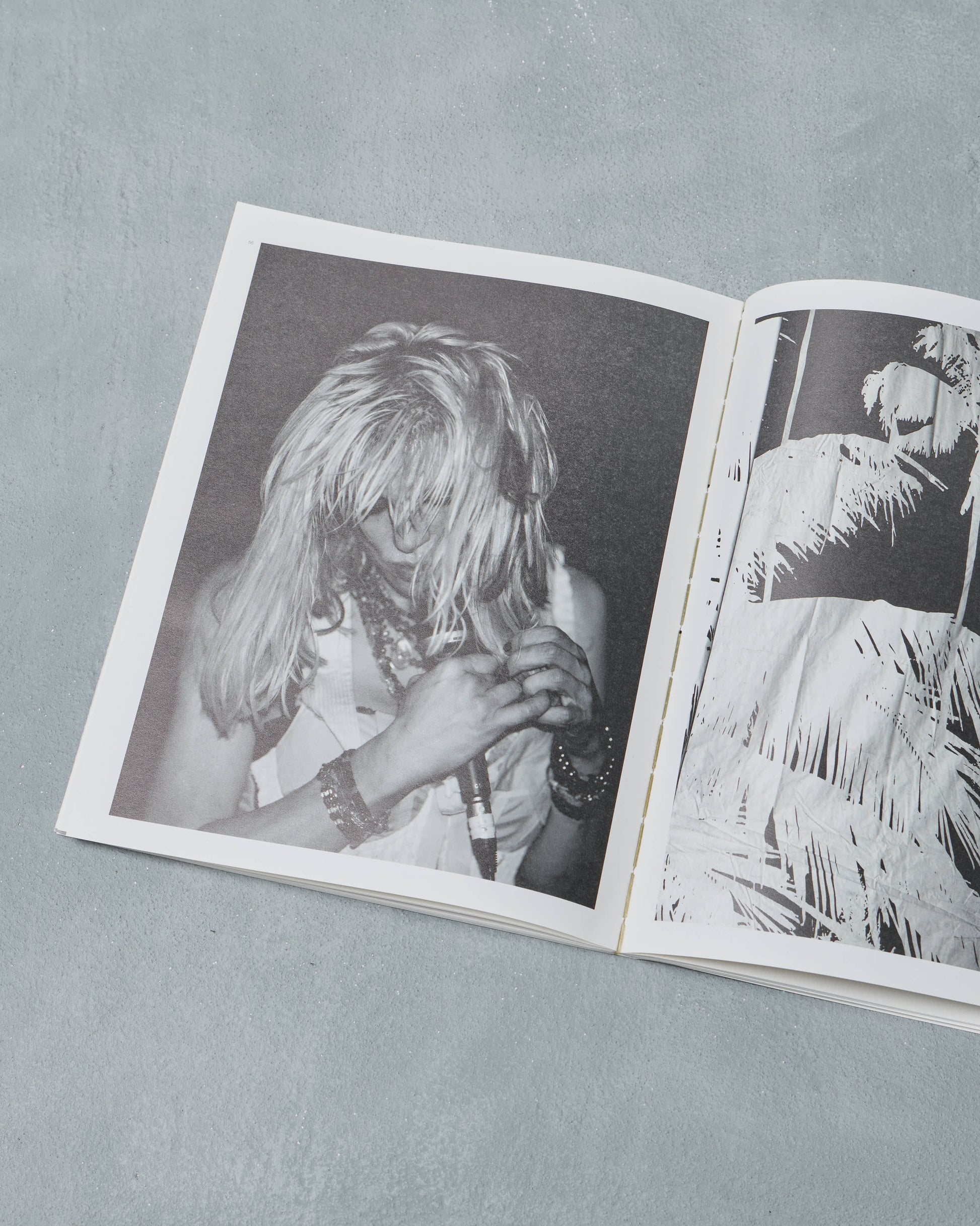 Open Ppaper Magazine with black and white photographs on a gray background