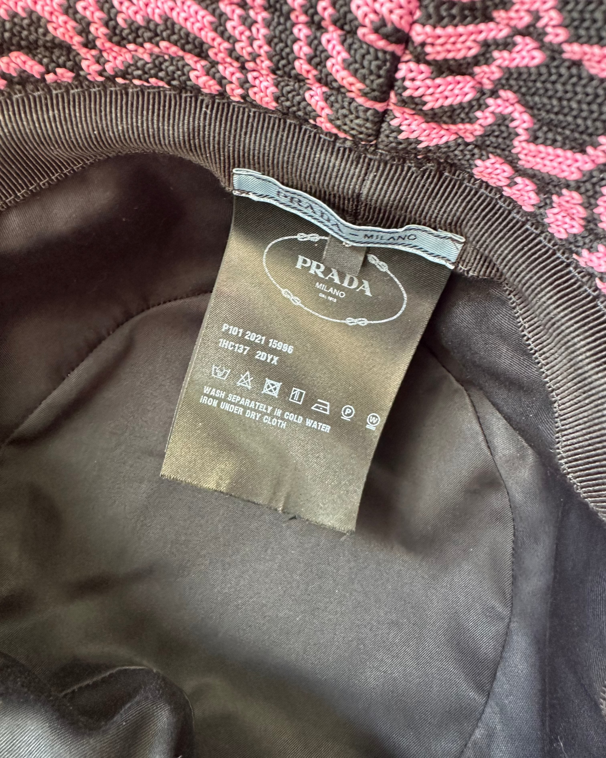 Close-up of a Prada label on a textured fabric background