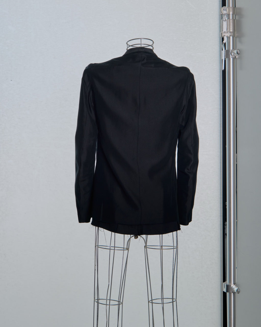 Black Song For The Mute jacket on a mannequin against a plain background